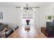 Bright dining room with hardwood floors, modern light fixture, and comfortable seating at 3929 Shoshone St, Denver, CO 80211