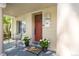 Cozy front porch featuring a decorative door, charming plants, and a welcoming atmosphere at 3929 Shoshone St, Denver, CO 80211