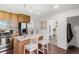 Open kitchen with granite countertops, stainless appliances, and seating at the island at 3929 Shoshone St, Denver, CO 80211
