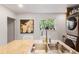 Bright kitchen features a large sink, granite counters, and a window with plants at 3929 Shoshone St, Denver, CO 80211