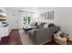 Comfortable living room featuring a large sectional sofa, wood floors, and a bright airy feel at 3929 Shoshone St, Denver, CO 80211