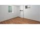 Bright basement space featuring wood floors, recessed lighting, and natural light from windows at 8209 Benton Way, Arvada, CO 80003