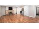 Cozy basement with a brick fireplace, wood flooring, and modern finishes at 8209 Benton Way, Arvada, CO 80003