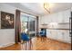 Bright dining area adjacent to kitchen with patio access and a glass top table at 8209 Benton Way, Arvada, CO 80003