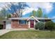 Well maintained single-Gathering home featuring brick exterior, manicured lawn, and attached garage, in a serene neighborhood at 8209 Benton Way, Arvada, CO 80003
