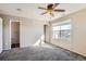 Comfortable bedroom with ceiling fan and window at 164 Bristlecone St, Brighton, CO 80601