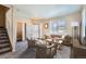 Bright living room featuring a cozy sofa and large windows at 164 Bristlecone St, Brighton, CO 80601