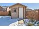 Tan storage shed in backyard at 164 Bristlecone St, Brighton, CO 80601