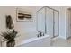 Luxurious bathroom featuring a soaking tub, frameless glass shower, and stylish tile work at 12762 Bend Ct, Firestone, CO 80504