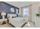 Comfortable bedroom with wallpapered accent wall, plush carpet, and natural light at 12762 Bend Ct, Firestone, CO 80504
