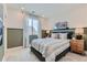 Cozy bedroom with plush carpet, designer bedding, and soft natural light at 12762 Bend Ct, Firestone, CO 80504