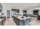 Spacious kitchen with large island, stainless steel appliances, pantry and adjacent living space at 12762 Bend Ct, Firestone, CO 80504
