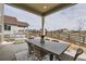 Covered patio with a dining table and an outdoor lounge area at 12762 Bend Ct, Firestone, CO 80504
