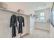 Bright walk-in closet featuring ample shelving and storage space at 12762 Bend Ct, Firestone, CO 80504