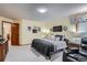 Bright bedroom with a king-size bed and plenty of natural light at 19 Carla Way, Broomfield, CO 80020