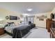 Bedroom featuring a queen-size bed, ample natural light, and neutral decor at 19 Carla Way, Broomfield, CO 80020