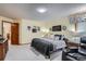 Bedroom featuring a queen-size bed, ample natural light, and neutral decor at 19 Carla Way, Broomfield, CO 80020