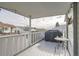 Outdoor deck featuring a grill, seating, and views of the neighborhood at 19 Carla Way, Broomfield, CO 80020