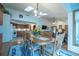 Bright dining area with an oak table and chairs, plus access to the kitchen and living room at 19 Carla Way, Broomfield, CO 80020