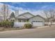 Ranch-style home with white porch and attached garage at 19 Carla Way, Broomfield, CO 80020