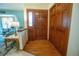 Entryway featuring wood floors, a closet, and views into the living area at 19 Carla Way, Broomfield, CO 80020