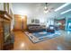 Cozy living room with hardwood floors, a fireplace, and a comfortable brown leather sofa set at 19 Carla Way, Broomfield, CO 80020