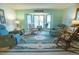 Inviting living room with large windows providing natural light and comfortable seating at 19 Carla Way, Broomfield, CO 80020
