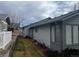 Exterior side view featuring light-blue siding, trimmed windows, and well-kept landscape at 19 Carla Way, Broomfield, CO 80020