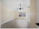 Bright bedroom with vaulted ceiling, fan, neutral flooring and walls, and window at 708 S Carlton St, Castle Rock, CO 80104