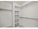 A walk-in closet with shelving and a carpeted floor at 708 S Carlton St, Castle Rock, CO 80104