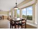 Cozy dining area with a view of the backyard, featuring a fireplace and built-in cabinets for ambiance and charm at 708 S Carlton St, Castle Rock, CO 80104