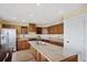 Bright kitchen with stainless steel appliances, a gas cooktop, and ample wood cabinets for storage at 708 S Carlton St, Castle Rock, CO 80104