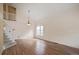 Bright living room with hardwood floors, vaulted ceilings, and stairs to an open loft space at 708 S Carlton St, Castle Rock, CO 80104