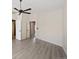 Main bedroom with neutral colored walls and flooring, multiple doorways and ceiling fan at 708 S Carlton St, Castle Rock, CO 80104