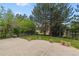 Large backyard featuring a concrete patio and grass area at 9117 Buck Hill Dr, Highlands Ranch, CO 80126