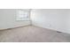 Spare bedroom featuring a window with blinds, neutral walls, and carpet flooring at 9117 Buck Hill Dr, Highlands Ranch, CO 80126