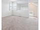 Spare bedroom featuring a corner window, neutral walls, and carpet flooring at 9117 Buck Hill Dr, Highlands Ranch, CO 80126