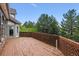 A lovely deck connected to the home featuring a wood railing, wood flooring, and a delightful outdoor space at 9117 Buck Hill Dr, Highlands Ranch, CO 80126
