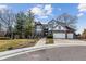 Charming two-story home with brick and Tudor accents, and a three-car garage at 9117 Buck Hill Dr, Highlands Ranch, CO 80126