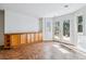 Cozy dining area features tile flooring, built-in cabinets, and French doors leading to the backyard at 9117 Buck Hill Dr, Highlands Ranch, CO 80126