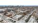 Aerial view of the neighborhood showcasing proximity to the city and surrounding residential area in winter at 3005 California St, Denver, CO 80205