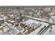 Aerial view of the neighborhood, showcasing the buildings with rooftop snow and the proximity to urban amenities at 3005 California St, Denver, CO 80205