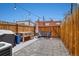 Inviting backyard with patio, grill, and charming wooden fence, perfect for relaxing or entertaining at 3005 California St, Denver, CO 80205