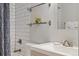 Bathroom showcases white subway tile, modern vanity, and a shower/tub combo at 3005 California St, Denver, CO 80205