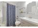 Bathroom features a shower and tub combo with white subway tile and modern vanity at 3005 California St, Denver, CO 80205