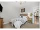 Bright bedroom features ceiling fan and carpet, with natural light coming from the windows at 3005 California St, Denver, CO 80205