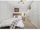 Bedroom features natural light, wooden accents, and a ceiling fan at 3005 California St, Denver, CO 80205