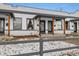 Charming home featuring a shared porch with wooden columns and a walkway to the entrances at 3005 California St, Denver, CO 80205