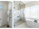 Bright and airy bathroom with a soaking tub, glass-enclosed shower, and modern fixtures at 2206 Alpine Dr, Boulder, CO 80304