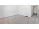 Spacious bedroom with neutral carpeting and an adjoining bathroom at 2206 Alpine Dr, Boulder, CO 80304